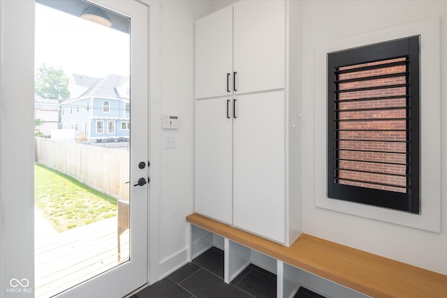 1905 N Alabama St, Indianapolis, IN 46202 - mudroom with dark tile patterned floors and baseboards
