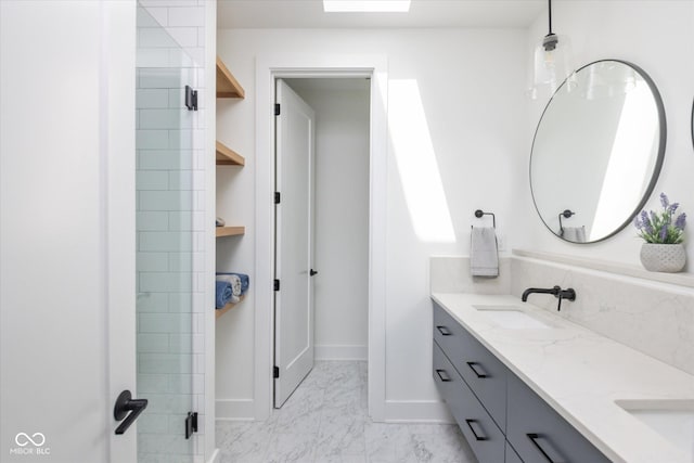 1905 N Alabama St, Indianapolis, IN 46202 - bathroom featuring double vanity, marble finish floors, and a shower with shower door