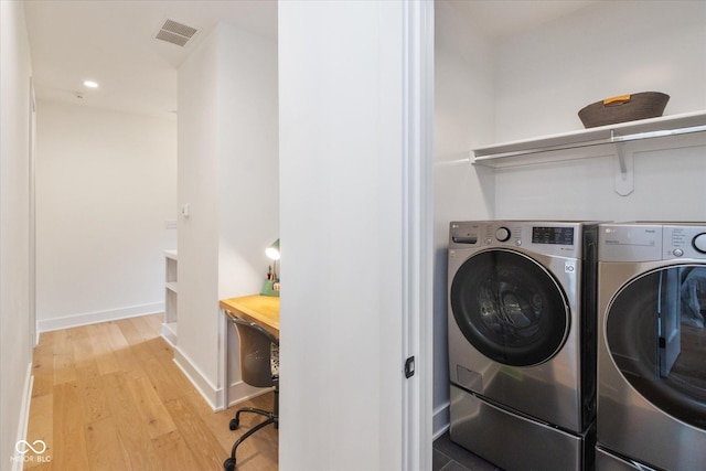 1905 N Alabama St, Indianapolis, IN 46202 - laundry area featuring washing machine and dryer, wood finished floors, and recessed lighting