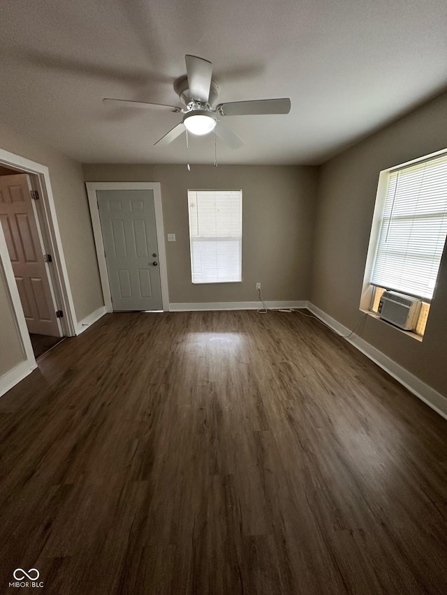 1810 N Parker Ave, Indianapolis, IN 46218 - entryway featuring plenty of natural light, cooling unit, dark wood finished floors, and a ceiling fan