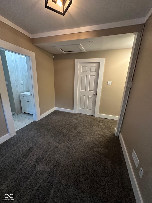 1810 N Parker Ave, Indianapolis, IN 46218 - carpeted spare room with attic access and baseboards
