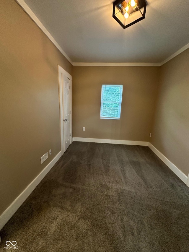 1810 N Parker Ave, Indianapolis, IN 46218 - unfurnished room featuring crown molding and dark carpet