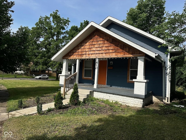 1810 N Parker Ave, Indianapolis, IN 46218 - view of front of property featuring covered porch and a front lawn