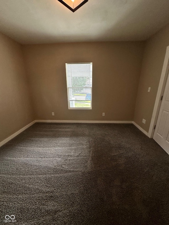 1810 N Parker Ave, Indianapolis, IN 46218 - unfurnished room with dark carpet