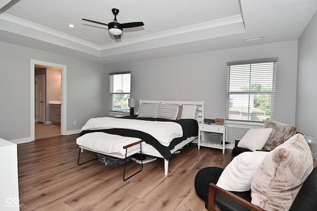 2734 Chalbury Dr, Plainfield, IN 46168 - bedroom featuring a raised ceiling, wood finished floors, a ceiling fan, connected bathroom, and recessed lighting