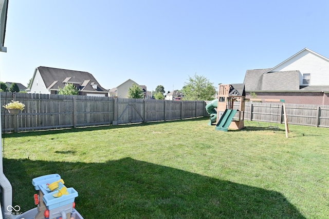 2734 Chalbury Dr, Plainfield, IN 46168 - fenced backyard featuring a playground and a residential view