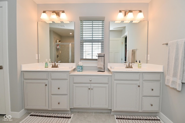 2734 Chalbury Dr, Plainfield, IN 46168 - full bathroom featuring a stall shower, double vanity, and tile patterned flooring