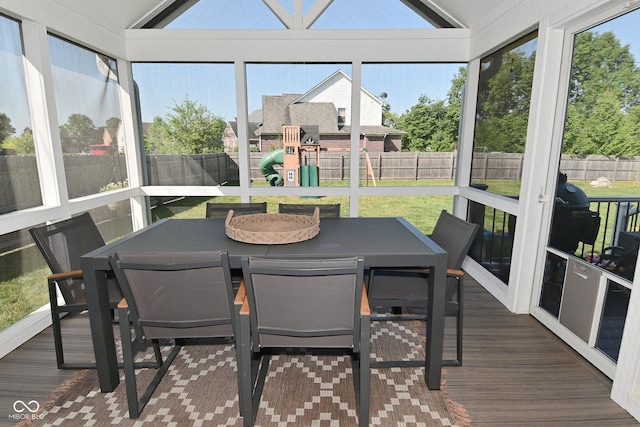 2734 Chalbury Dr, Plainfield, IN 46168 - sunroom / solarium featuring lofted ceiling, wood finished floors, outdoor dining area, healthy amount of natural light, and a wooden deck