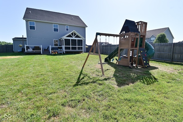 2734 Chalbury Dr, Plainfield, IN 46168 - back of house with a playground, a fenced backyard, and a sunroom