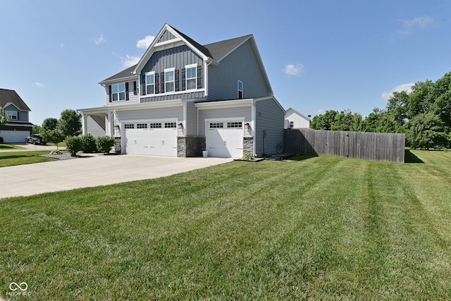 2734 Chalbury Dr, Plainfield, IN 46168 - view of front of property with board and batten siding, an attached garage, stone siding, and concrete driveway