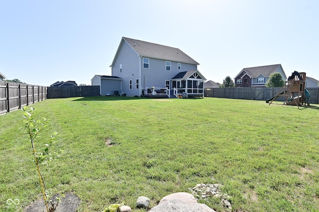 2734 Chalbury Dr, Plainfield, IN 46168 - fenced backyard with a playground and a sunroom