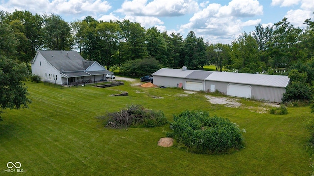 7516 S County Road 300 W, Clayton, IN 46118 - view of grassy yard featuring a detached garage and an outbuilding