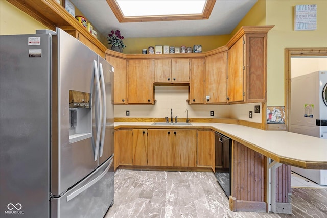 7516 S County Road 300 W, Clayton, IN 46118 - kitchen featuring stainless steel fridge, stacked washer / dryer, a peninsula, light countertops, and black dishwasher