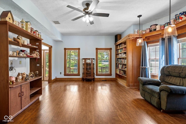 7516 S County Road 300 W, Clayton, IN 46118 - living area with a textured ceiling, a ceiling fan, and wood-type flooring