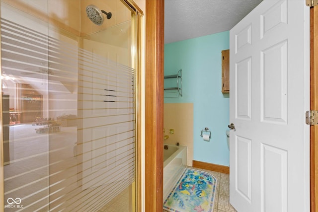 7516 S County Road 300 W, Clayton, IN 46118 - bathroom featuring a stall shower, a bath, tile patterned floors, and a textured ceiling