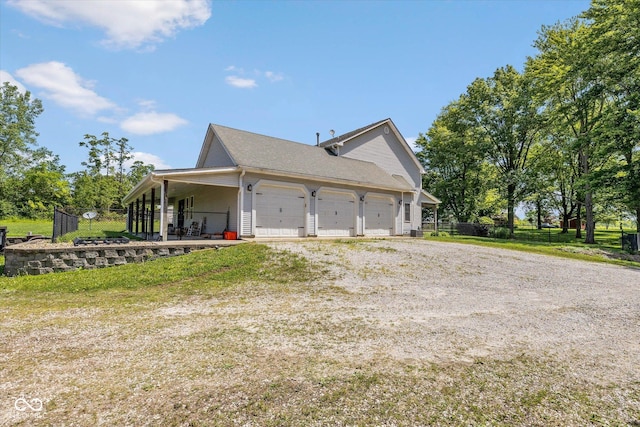 7516 S County Road 300 W, Clayton, IN 46118 - view of side of property featuring driveway and an attached garage