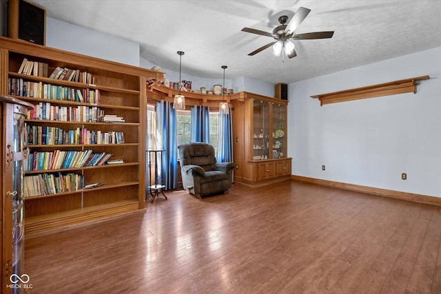 7516 S County Road 300 W, Clayton, IN 46118 - sitting room with ceiling fan, hardwood / wood-style floors, and a textured ceiling
