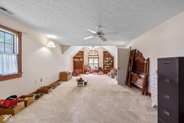 7516 S County Road 300 W, Clayton, IN 46118 - unfurnished bedroom with carpet floors, multiple windows, a textured ceiling, and ceiling fan