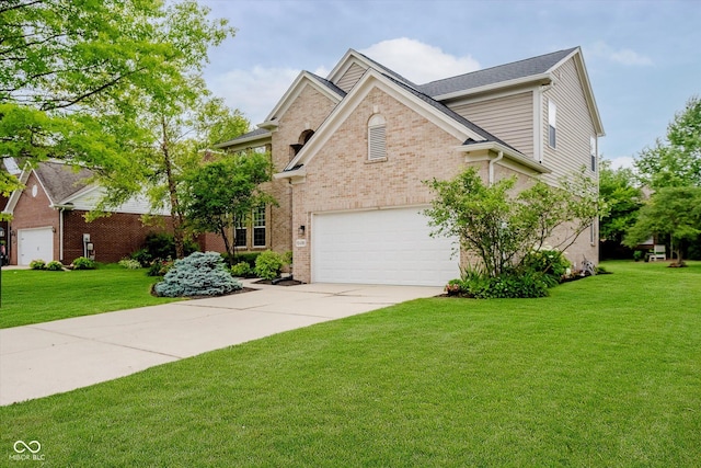 12490 Windbush Way, Carmel, IN 46033 - traditional home with driveway, brick siding, and a front yard