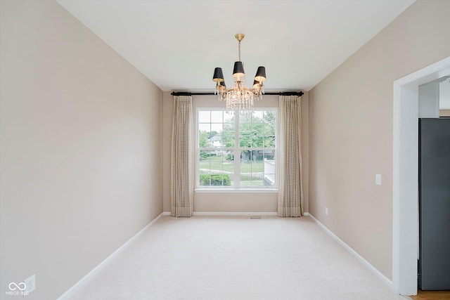 12490 Windbush Way, Carmel, IN 46033 - spare room featuring a chandelier and light colored carpet