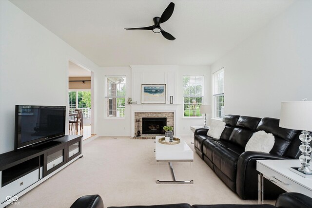 12490 Windbush Way, Carmel, IN 46033 - living area featuring a ceiling fan, a fireplace, and light carpet