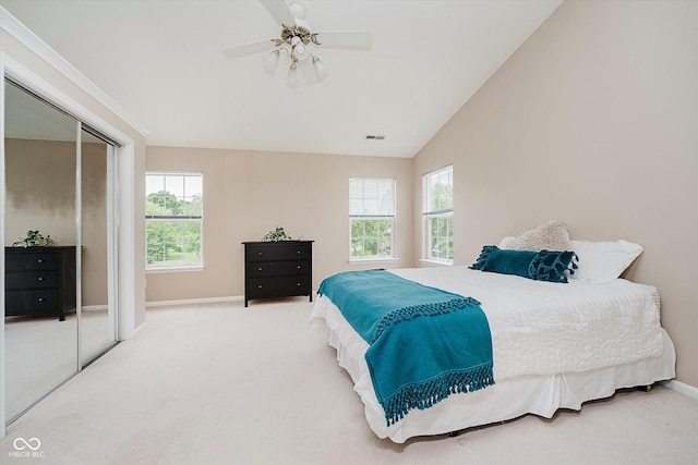 12490 Windbush Way, Carmel, IN 46033 - carpeted bedroom with multiple windows, ceiling fan, and vaulted ceiling