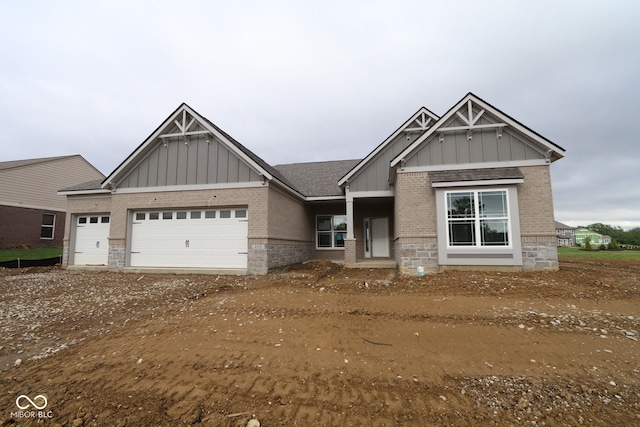 4999 Hummingbird Dr, Brownsburg, IN 46112 - craftsman inspired home featuring board and batten siding, brick siding, an attached garage, driveway, and a shingled roof