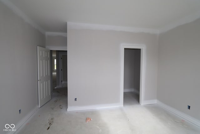 4999 Hummingbird Dr, Brownsburg, IN 46112 - unfurnished bedroom featuring a walk in closet and baseboards