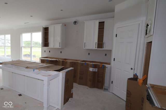 4999 Hummingbird Dr, Brownsburg, IN 46112 - kitchen featuring open shelves and white cabinetry