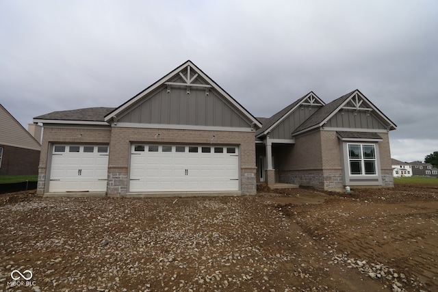 4999 Hummingbird Dr, Brownsburg, IN 46112 - craftsman house featuring board and batten siding, a garage, brick siding, and stone siding