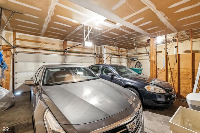 2463 Kettering Way, Indianapolis, IN 46214 - garage with a garage door opener and washer and clothes dryer