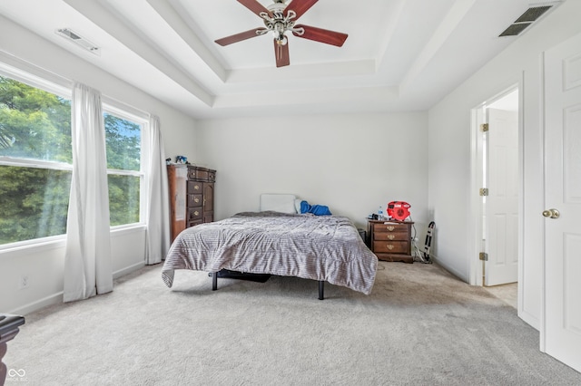 2463 Kettering Way, Indianapolis, IN 46214 - carpeted bedroom with a tray ceiling and a ceiling fan