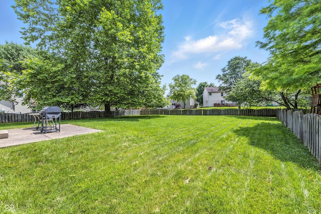 2463 Kettering Way, Indianapolis, IN 46214 - fenced backyard with a patio area