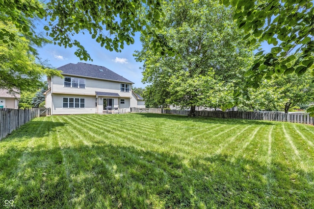 2463 Kettering Way, Indianapolis, IN 46214 - rear view of house with a fenced backyard