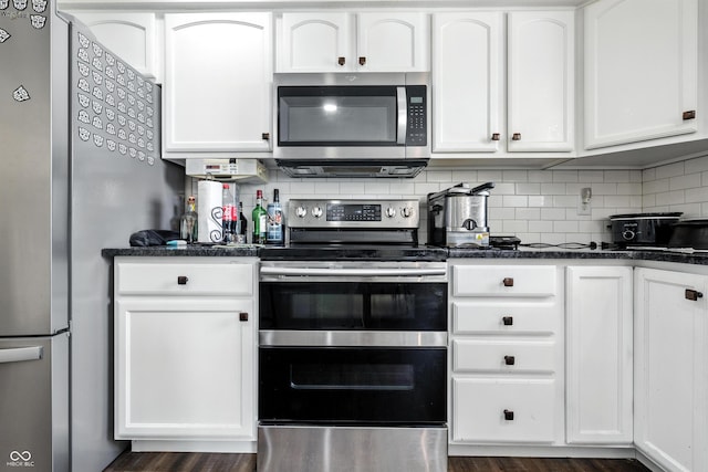 2463 Kettering Way, Indianapolis, IN 46214 - kitchen featuring stainless steel appliances, white cabinetry, and backsplash