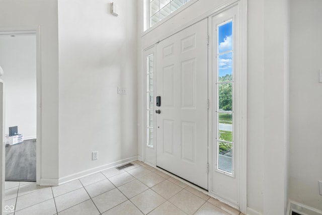 2463 Kettering Way, Indianapolis, IN 46214 - entryway featuring plenty of natural light and light tile patterned floors