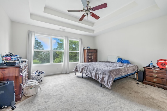 2463 Kettering Way, Indianapolis, IN 46214 - bedroom featuring carpet, a raised ceiling, and ceiling fan