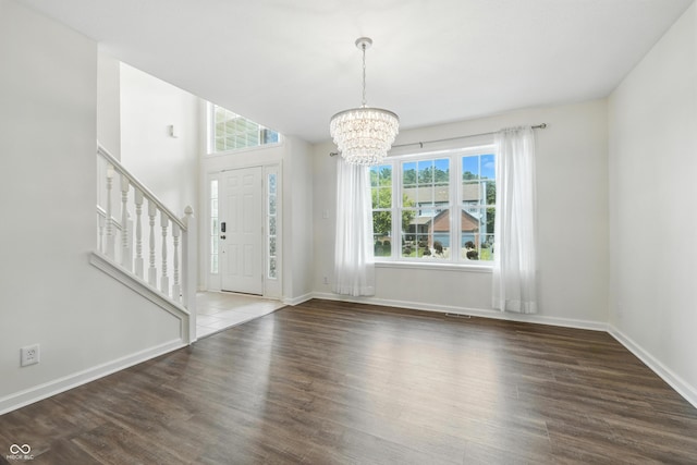 2463 Kettering Way, Indianapolis, IN 46214 - entryway with a chandelier, wood finished floors, and stairs