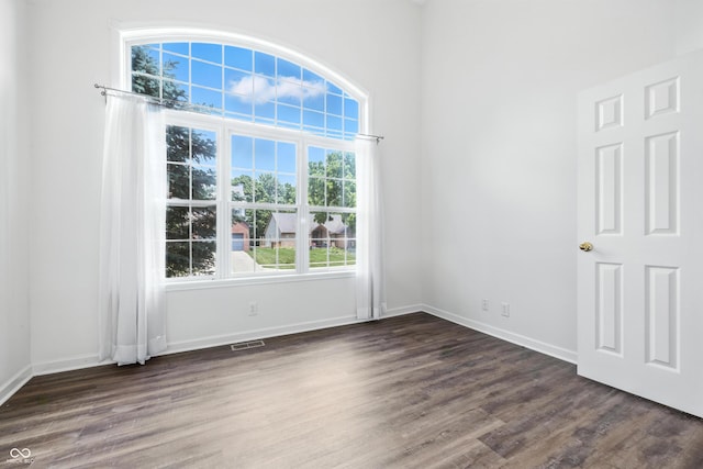2463 Kettering Way, Indianapolis, IN 46214 - empty room featuring dark wood-style flooring and baseboards