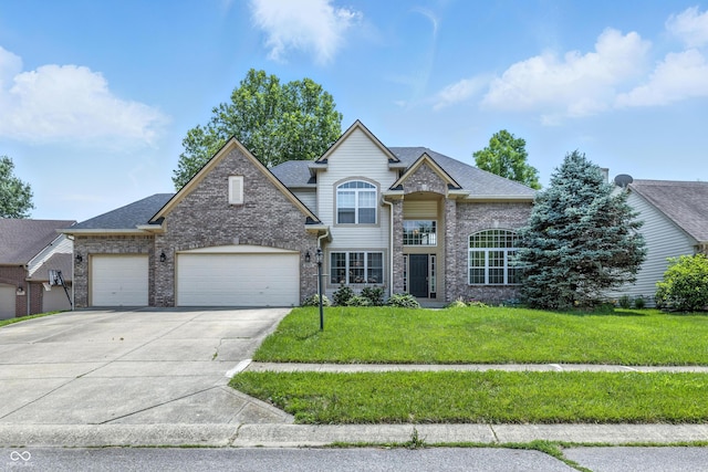 2463 Kettering Way, Indianapolis, IN 46214 - traditional-style home with concrete driveway, a front lawn, a garage, brick siding, and roof with shingles