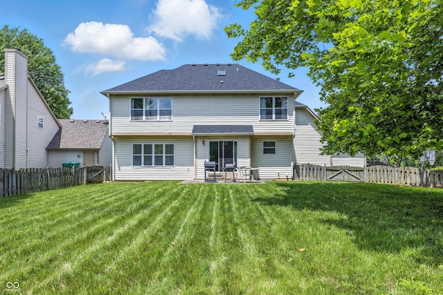 2463 Kettering Way, Indianapolis, IN 46214 - rear view of property with a fenced backyard, a patio, and roof with shingles