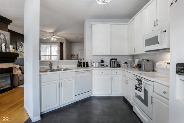 9525 Longwell Dr, Indianapolis, IN 46240 - kitchen featuring white appliances, a ceiling fan, white cabinets, and light countertops
