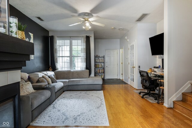 9525 Longwell Dr, Indianapolis, IN 46240 - living area with wood finished floors, a ceiling fan, a desk, and stairway