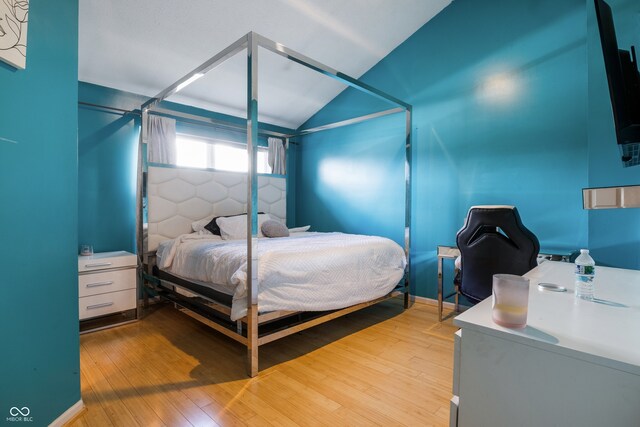 9525 Longwell Dr, Indianapolis, IN 46240 - bedroom featuring hardwood / wood-style flooring and lofted ceiling