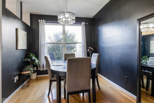 9525 Longwell Dr, Indianapolis, IN 46240 - dining room with a chandelier and light wood-style floors