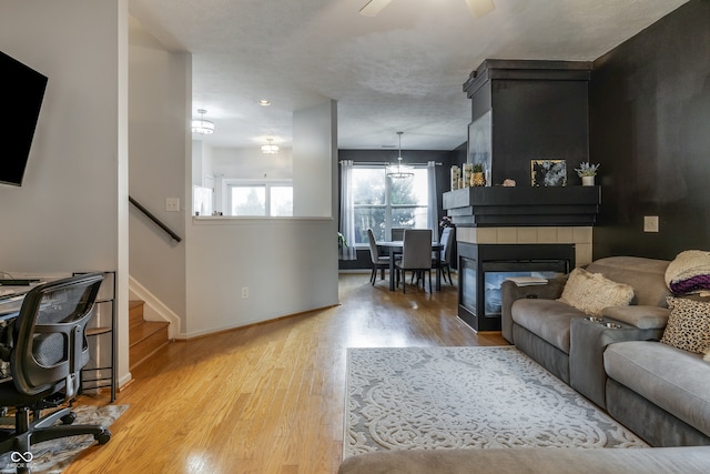 9525 Longwell Dr, Indianapolis, IN 46240 - living area with wood finished floors, stairway, and a ceiling fan