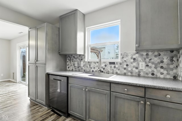 1236 N Aberdeen Dr, Franklin, IN 46131 - kitchen with dishwasher, gray cabinetry, wood finished floors, and decorative backsplash