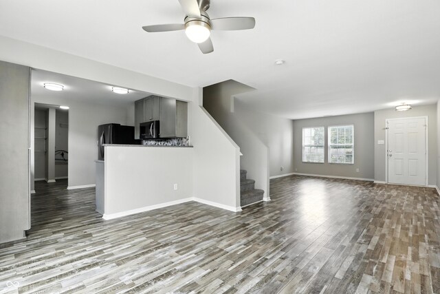 1236 N Aberdeen Dr, Franklin, IN 46131 - unfurnished living room featuring wood finished floors, stairway, and a ceiling fan
