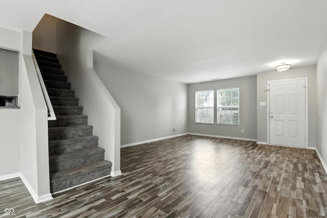 1236 N Aberdeen Dr, Franklin, IN 46131 - unfurnished living room featuring dark wood-style flooring and stairs