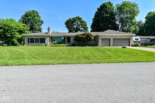 136 W Loretta Dr, Indianapolis, IN 46217 - single story home featuring an attached garage, a chimney, a front lawn, and driveway